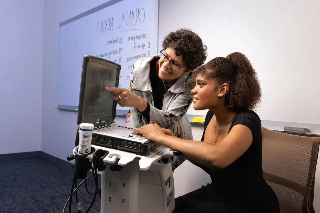 Student working with professor.